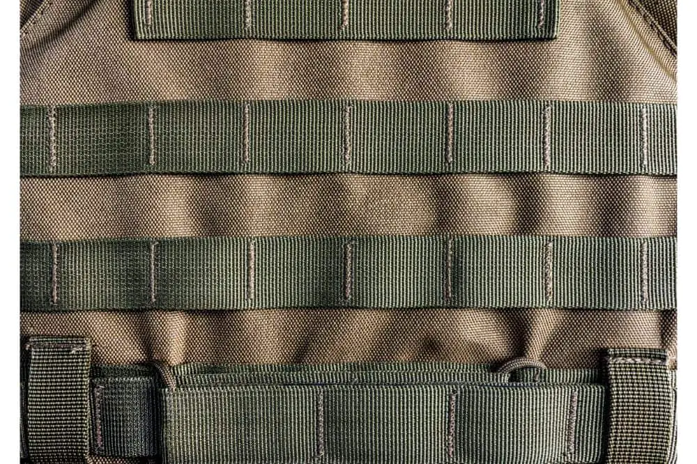 Military olive colored modern armor vest with molle system.