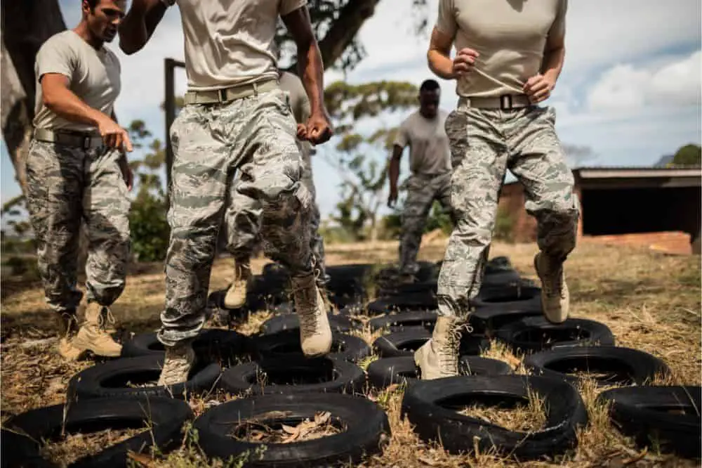 Trainer giving training to military soldiers