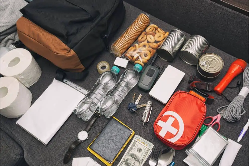 Emergency backpack equipment organized on the table